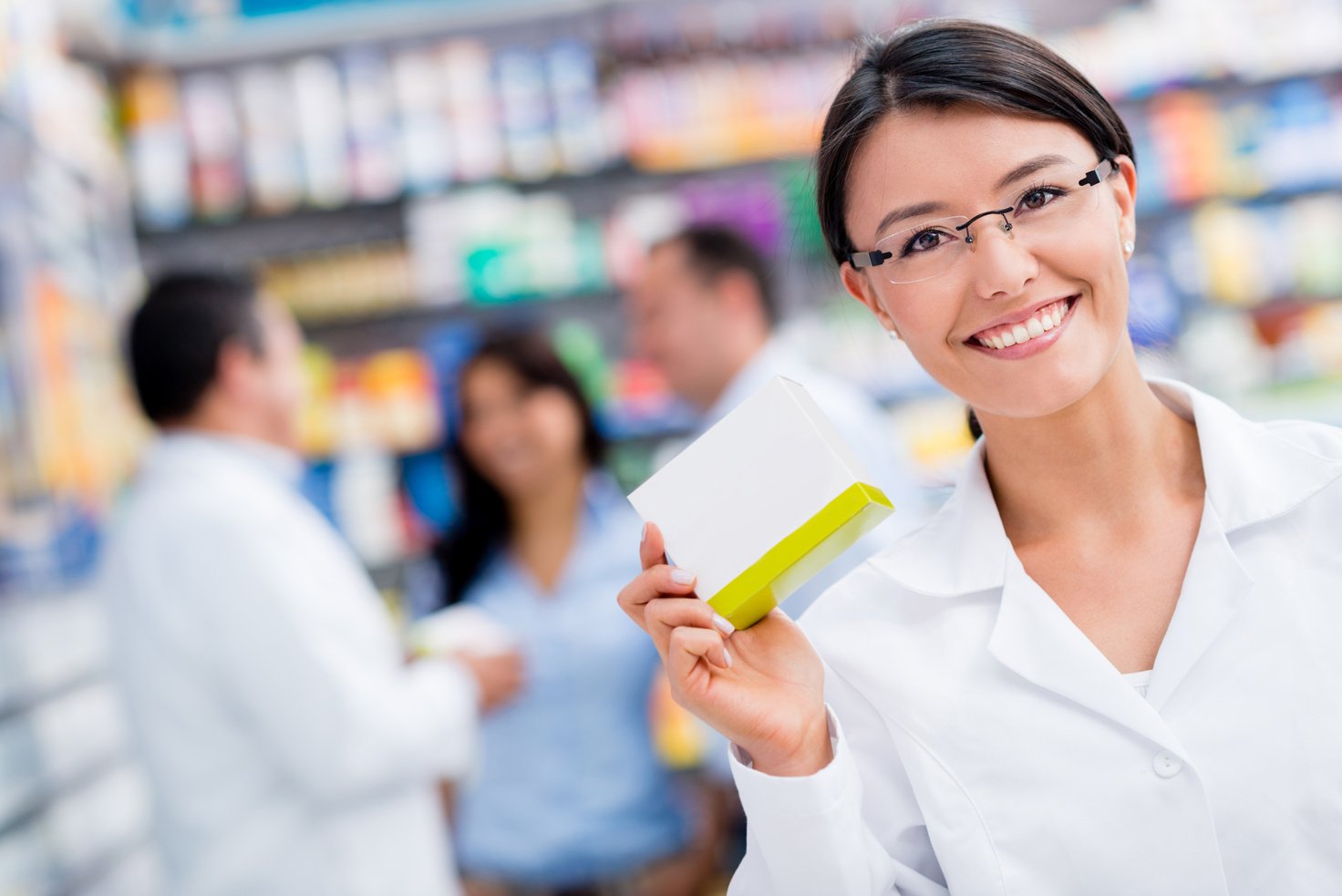 Pharmacist holding prescription medicine